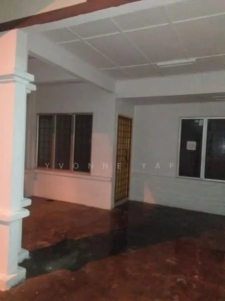 Room features: white painted walls, ceiling with tiles, concrete flooring, two windows with grilles, one door with wooden frame, open layout, no visible furniture, neutral lighting.
