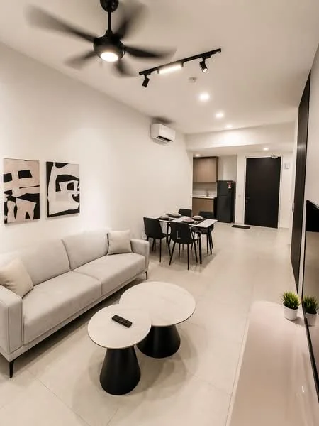 Living features: 3-seater fabric sofa in light grey, 2 round coffee tables with black bases, ceiling fan with 5 blades, recessed LED downlights, wall-mounted TV, air conditioning unit, light-coloured tile flooring, decorative wall art with abstract designs; style: modern. Dining features: 4-seater dining table, black dining chairs, open kitchen area visible, kitchen cabinetry, fridge visible in kitchen area; style: modern.