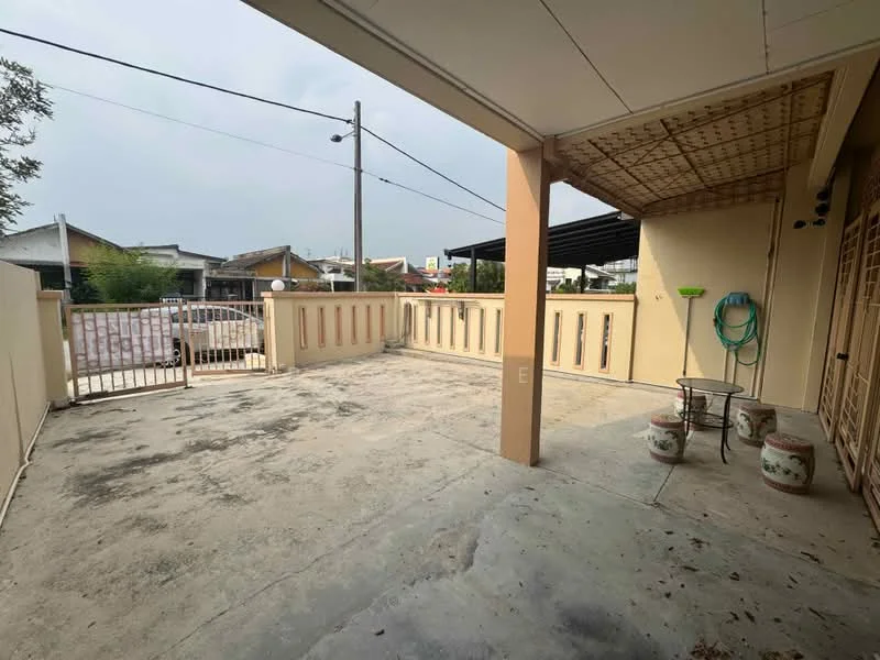 Exterior type: detached bungalow; features: concrete flooring, fenced perimeter, gate at entrance, covered porch area, outdoor seating area, garden hose, decorative planters, utility poles visible, surrounding residential buildings; style: modern.