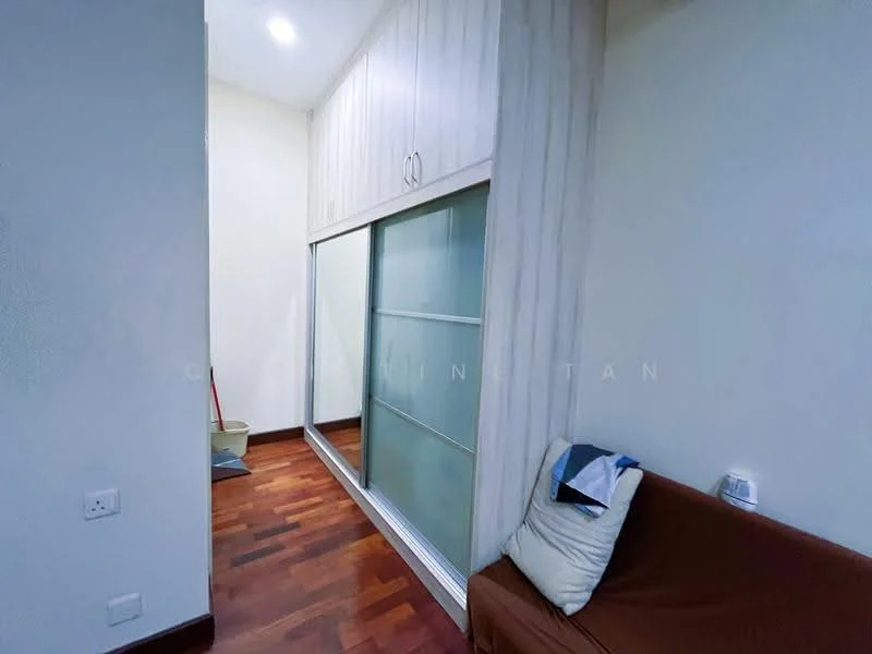 Room features: wood flooring, white painted walls, built-in wardrobe with sliding glass doors, recessed ceiling lights, sofa, cleaning tools visible, neutral color scheme; style: modern.