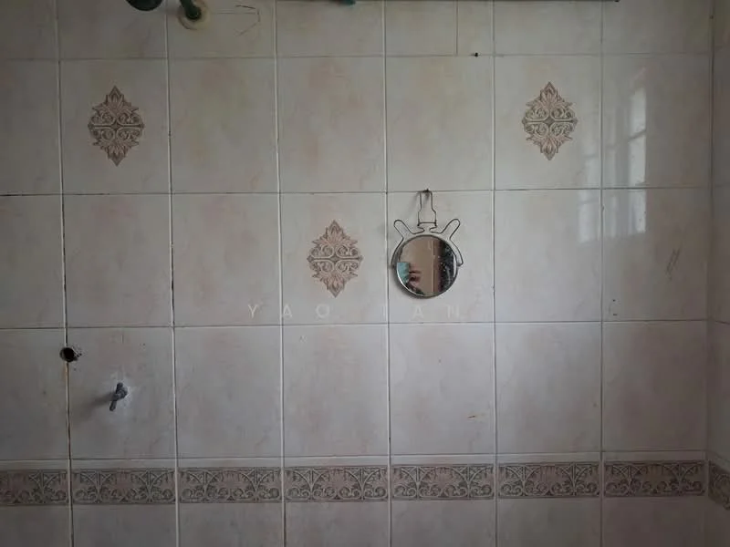 Bathroom features: white tiled walls, decorative tile accents, mirror, wall-mounted faucet, showerhead connection, unknown plumbing fixtures.