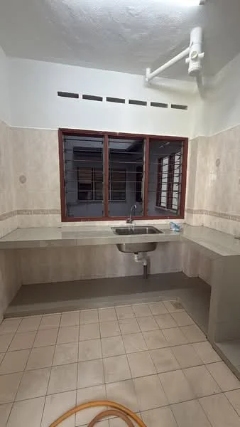 Kitchen features: single-bowl stainless-steel sink, chrome pull-down faucet, laminate countertop, cream tiled backsplash, light beige wall tiles, grey floor tiles, window with grid pattern, open shelving above countertop, kitchen cabinetry, exposed plumbing, no visible appliances.