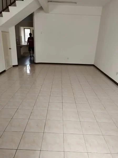 Room features: white painted walls, cream tiled flooring, open layout, large windows, staircase visible, neutral color scheme, no visible furniture, high ceiling; style: modern.