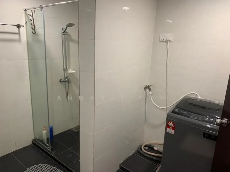 Laundry features: glass shower enclosure, shower head, wall-mounted shower faucet, black tile flooring, white tiled walls, washing machine, drainage hose, towel rack.
