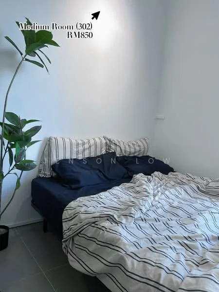 Bedroom features: queen-size bed with striped bedding, two pillows with striped covers, green potted plant, white painted walls, grey tile flooring, wall-mounted light fixture; style: modern.