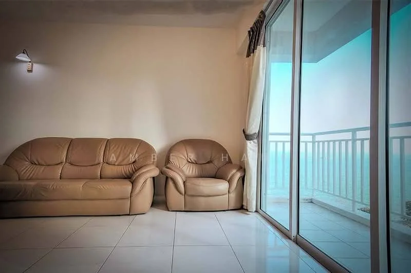 Living features: beige leather 3-seater sofa, beige leather armchair, white painted walls, white ceiling, large sliding glass door, floor-to-ceiling windows, white curtains, glossy white tile flooring, wall-mounted light fixture; style: modern; view: sea.
