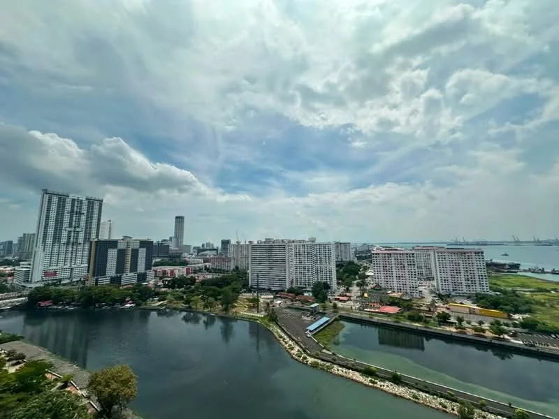 Exterior type: high-rise condominium; features: city skyline view, waterfront, surrounded by greenery, multiple high-rise buildings, manicured landscaping, urban setting, open sky, water bodies; style: modern.