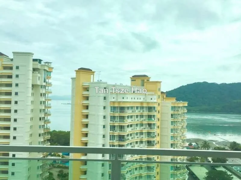 Exterior type: high-rise condominium; features: yellow painted facade, glass balcony railings, multiple storeys, waterfront view, surrounded by greenery, mountain view in background; style: modern.