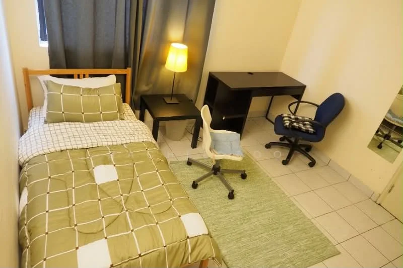 Bedroom features: single bed with beige and white checkered bedding, wooden bed frame, desk with black surface, blue office chair with wheels, white swivel chair, green area rug, floor lamp with yellow shade, grey curtains, white walls, tile flooring; style: minimalist.