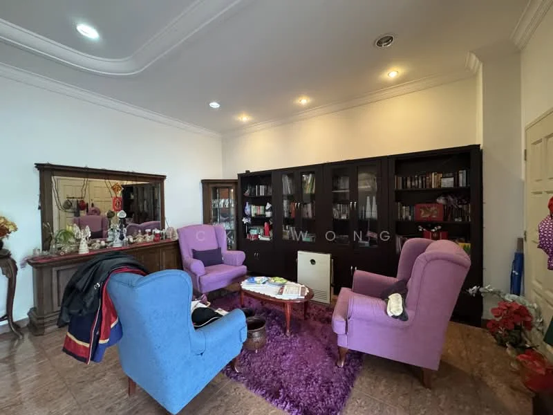 Living features: two purple upholstered armchairs, one blue upholstered armchair, round coffee table, purple area rug, wooden bookshelf with glass doors, decorative mirror, wall-mounted lights, white painted walls, crown moulding, ceramic tile flooring; style: traditional.