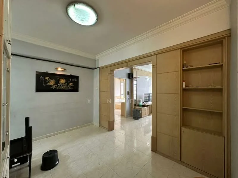 Room features: white painted walls, cream tiled flooring, recessed ceiling light, built-in wooden shelving, open doorway leading to another room, decorative wall art, corner space for furniture, neutral color scheme; style: modern.