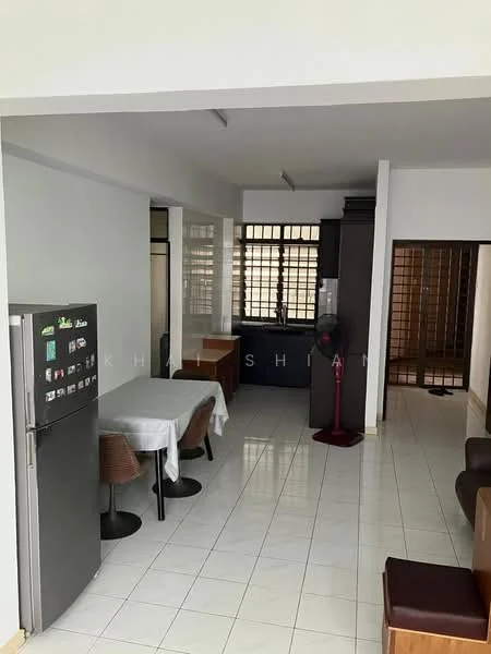 Dining features: white walls, white tiled flooring, dining table with tablecloth, 4 dining chairs, refrigerator, floor-mounted fan; style: modern. Kitchen features: black cabinetry, stainless-steel refrigerator, open layout, window for natural light; style: modern. Living features: brown leather sofa, coffee table, white walls, white tiled flooring; style: modern.