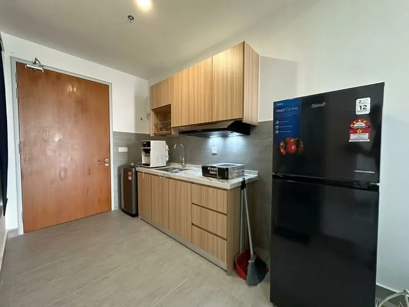 Kitchen features: wood cabinetry, grey countertop, single-bowl stainless-steel sink, chrome pull-down faucet, built-in microwave, freestanding fridge, kitchen appliances, tile flooring, white painted walls, door to exterior; style: modern.