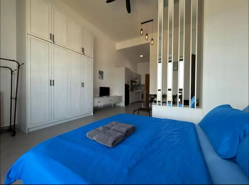 Bedroom features: blue bedding, queen-size bed, upholstered headboard, 2 bedside towels, built-in wardrobe with white doors, ceiling fan with light, wall-mounted TV, open layout to kitchen area, large window for natural light, neutral wall color, tile flooring; style: modern.