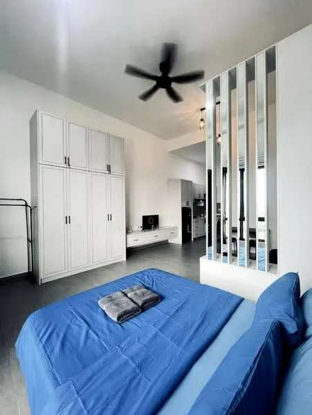 Bedroom features: king-size bed with blue bedding, 5-blade ceiling fan, white built-in wardrobe, light grey flooring, wall-mounted TV, white wall with vertical slats, decorative wall panel, open closet rack, natural light from windows; style: modern.