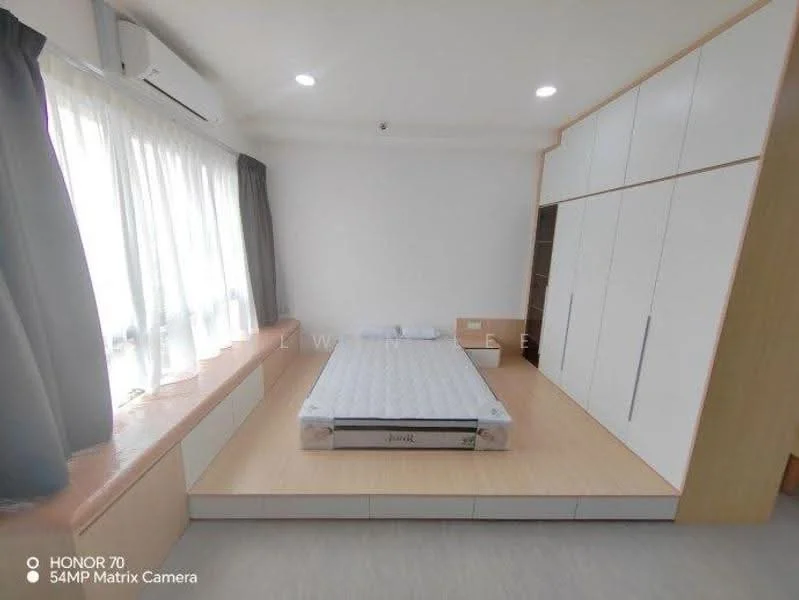 Bedroom features: large window with sheer curtains, built-in wardrobe with sliding doors, light wood flooring, white painted walls, air conditioning unit, platform bed base, mattress on bed base, recessed ceiling lights, window seat with storage, neutral color scheme; style: modern.