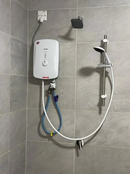 Bathroom features: shower head, handheld shower, shower mixer, wall-mounted shower system, grey tiled walls, grey tiled flooring, water heater, chrome fixtures; style: modern.