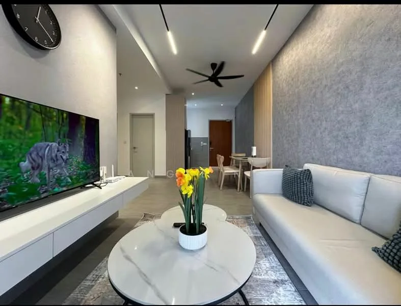 Living features: 3-seater fabric sofa in white, round coffee table with white surface, area rug with geometric pattern, wall-mounted TV, 5-blade ceiling fan with light, decorative wall clock, grey accent wall, light wood paneling, potted flowers on coffee table, dining table with chairs visible in background; style: modern.