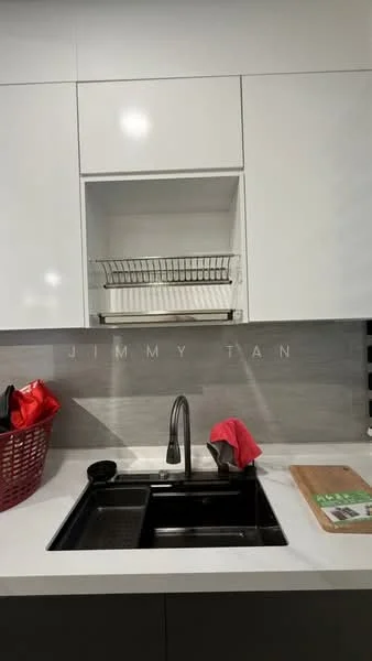 Kitchen features: black single-bowl stainless-steel sink, chrome pull-down faucet, white cabinetry, grey tile backsplash, white countertop, dish drying rack above sink, red dish towel, black basket, wooden cutting board; style: modern.