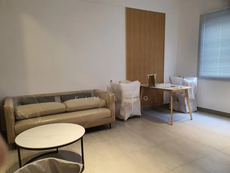 Living features: beige leather 3-seater sofa, round marble coffee table, light wood dining table, 4 dining chairs with white covers, wooden accent wall with vertical slats, grey tiled flooring, large window with blinds, neutral painted walls; style: modern.