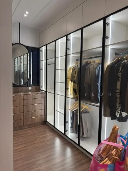 Room features: built-in wardrobe with glass doors, wooden cabinetry with gold handles, hanging space for clothes, LED strip lighting, full-length mirror, laminate flooring, neutral wall color, organized clothing display; style: modern.