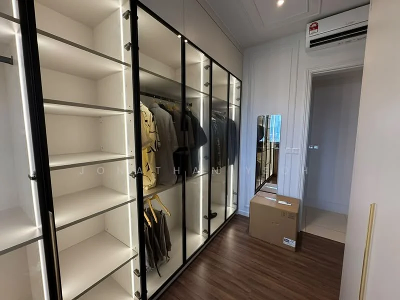 Room features: built-in wardrobe with glass doors, LED strip lighting, wooden flooring, hanging space for clothes, shelves for storage, mirror on wall, air conditioning unit, cardboard box on floor; style: modern.