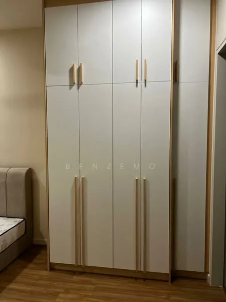 Room features: built-in wardrobe, white cabinetry, wooden handles, light wood trim, multiple storage compartments, smooth surface finish, modern design, laminate flooring; style: modern.