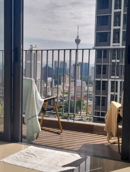 Room features: floor-to-ceiling windows, glass balcony railing, wooden flooring, city skyline view, outdoor seating, textiles on chairs, balcony space; style: modern; view: city.
