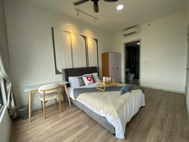 Bedroom features: king-size bed, upholstered headboard, white bedding, wooden bedside table, decorative tray on bed, study desk with chair, floor-to-ceiling window, light-colored curtains, wooden flooring, ceiling fan with light, wall-mounted air conditioning unit, built-in wardrobe, neutral wall color, accent wall with paneling; style: modern.