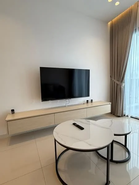Living features: wall-mounted flat-screen TV, light wood TV console, two round coffee tables with black metal frames, white marble tabletops, cream painted walls, floor-to-ceiling windows with sheer curtains, glossy tile flooring, recessed ceiling lights; style: modern.