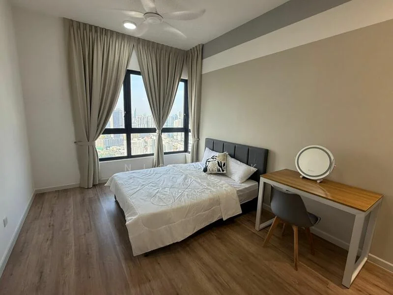 Bedroom features: queen-size bed with white bedding, upholstered headboard in grey, wooden study desk, grey chair, floor-to-ceiling windows, sheer curtains, wood laminate flooring, ceiling fan with light, decorative mirror on desk, city skyline view; style: modern; view: city.