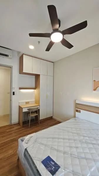 Bedroom features: queen-size bed, wooden flooring, 5-blade ceiling fan with light, built-in wardrobe with white doors, study desk with chair, wall-mounted light, decorative wall art, air conditioning unit; style: modern.