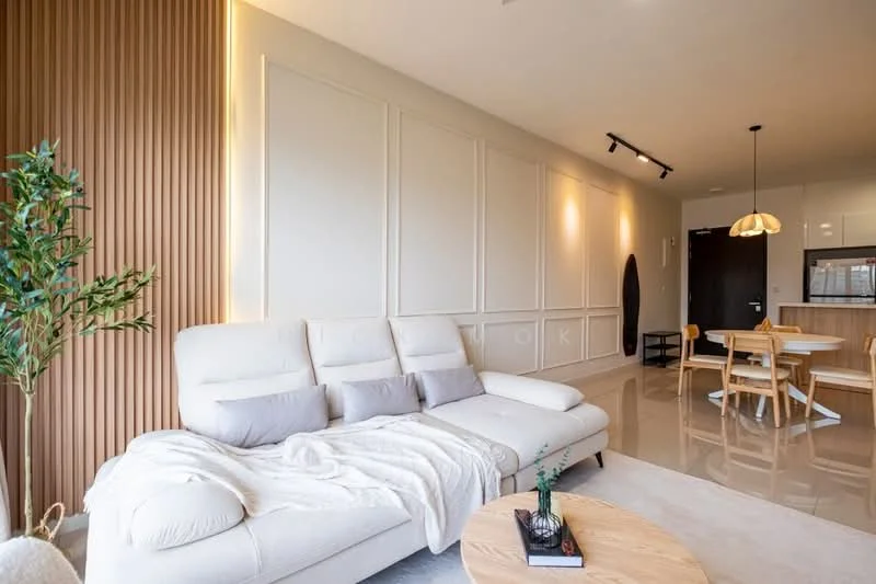 Living features: L-shape sectional sofa in cream, decorative throw blanket, wooden coffee table, area rug, wall-mounted lighting, wood panel accent wall, cream painted walls, recessed lighting, floor-to-ceiling windows, indoor plant, dining table with chairs in background, open layout to kitchen; style: modern.