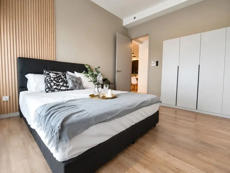 Bedroom features: king-size bed with upholstered headboard, white bedding with decorative pillows, grey throw blanket, wooden accent wall, laminate flooring, built-in wardrobe with sliding doors, nightstand with decorative items, wall-mounted light switch, floor-to-ceiling window, curtains, decorative plant; style: modern.