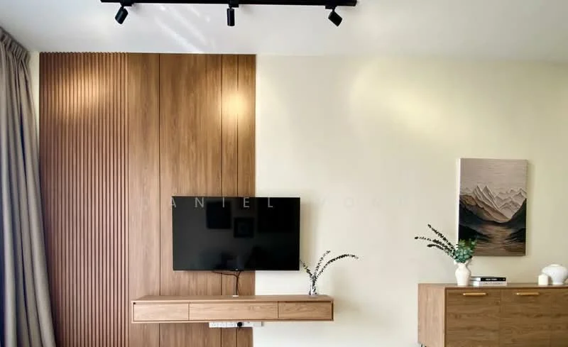 Living features: wood panel accent wall, light beige painted walls, recessed LED track lighting, wall-mounted flat-screen TV, wooden TV console, decorative vase with greenery, framed artwork, light wood sideboard; style: modern.