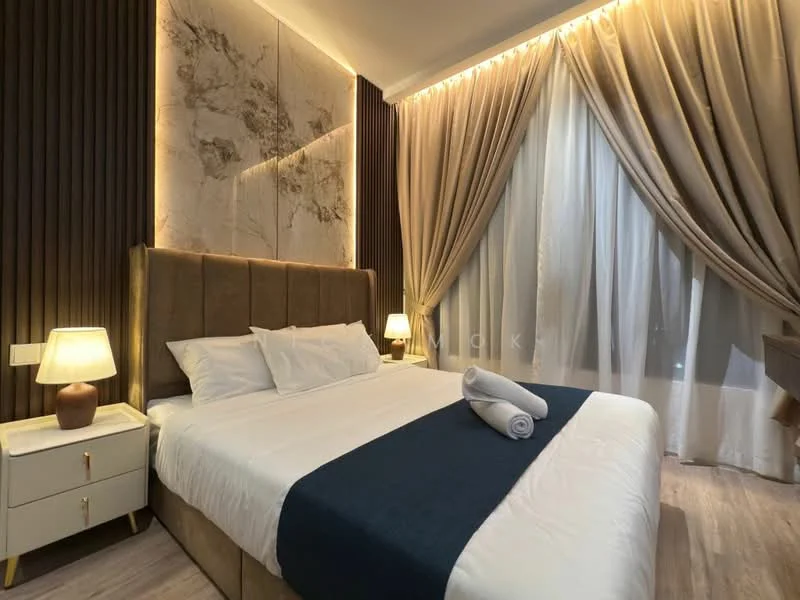 Bedroom features: king-size bed, upholstered headboard, white bedding, decorative throw blanket, nightstand with lamp, wooden flooring, curtains, wall paneling with marble accent, recessed lighting, decorative wall art; style: modern.