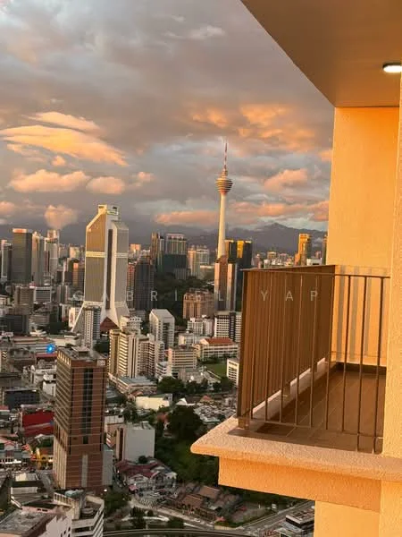 Room features: balcony with railing, city skyline view, floor-to-ceiling windows, sunset lighting, concrete flooring, neutral wall color, outdoor space, urban landscape; style: modern; view: city.