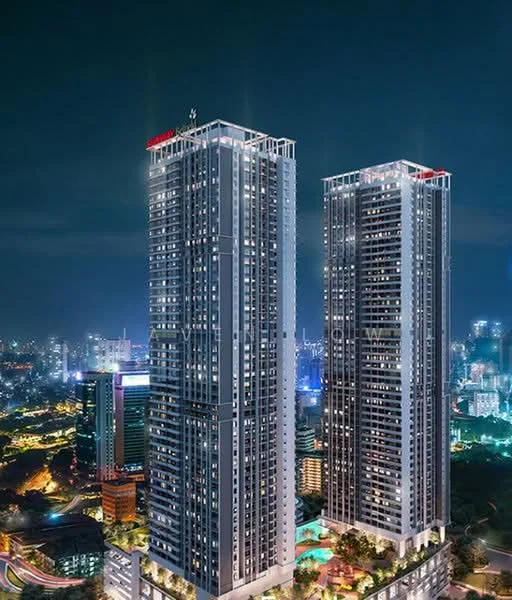 Exterior type: high-rise condominium; features: glass curtain wall, illuminated facade, recessed balconies, multiple storeys, surrounded by city skyline, night lighting, landscaped ground level, adjacent to urban environment; style: modern.