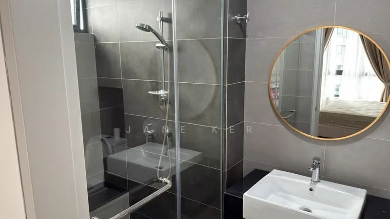 Bathroom features: walk-in shower with glass enclosure, rain shower head, handheld shower, freestanding bathtub, round mirror, white ceramic sink, chrome basin mixer, grey tiled walls, black countertop, tile flooring, window with sheer curtains; style: modern.