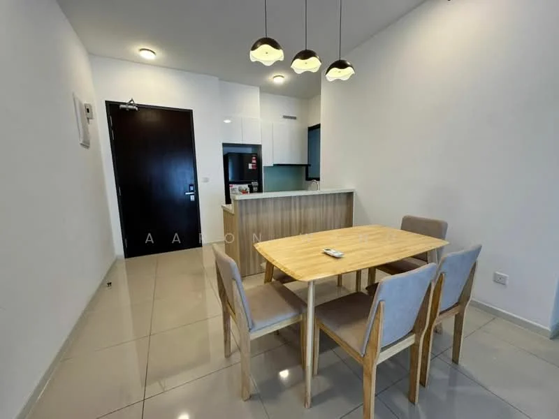 Dining features: 4-seater wooden dining table, grey upholstered dining chairs, pendant lighting with three bulbs, white painted walls, glossy tile flooring, open kitchen layout, kitchen island with breakfast bar, built-in cabinetry, refrigerator visible in kitchen area, door leading to hallway; style: modern.