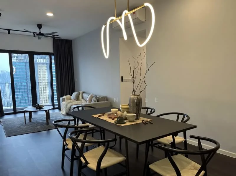 Dining features: black dining table, 6 dining chairs with woven seats, pendant light fixture with modern design, decorative vase on table, table setting with plates and cups, wooden flooring, floor-to-ceiling windows, city skyline view, sofa in background, area rug under dining table; style: modern; view: city.