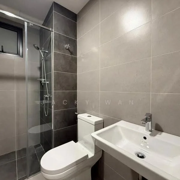 Bathroom features: grey tiled walls, white ceramic toilet, chrome basin mixer faucet, white sink with modern design, glass shower enclosure, rain shower head, handheld shower, dark grey tiled flooring, wall-mounted mirror, towel rail; style: modern.