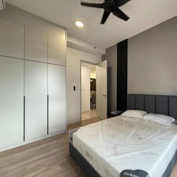 Bedroom features: queen-size bed, upholstered headboard, built-in wardrobe with sliding doors, wooden flooring, ceiling fan, wall-mounted light fixture, neutral wall colour, door leading to hallway; style: modern.