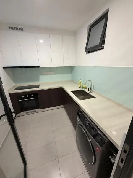 Kitchen features: white upper cabinets, dark wood lower cabinets, light-colored countertop, stainless-steel sink, chrome pull-down faucet, built-in oven, electric cooktop, front-load washing machine, tile flooring, green glass backsplash, window above sink; style: modern.