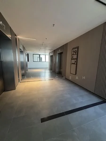 Room features: grey tile flooring, neutral painted walls, elevator doors, large windows, ceiling lights, numbered floor sign, wall paneling, open corridor layout; style: modern.