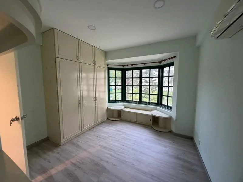 Bedroom features: built-in wardrobe with cream cabinetry, window seat with storage, large bay window, light grey laminate flooring, recessed ceiling lights, wall-mounted split AC unit, neutral painted walls, curtains on window; style: modern; view: garden.