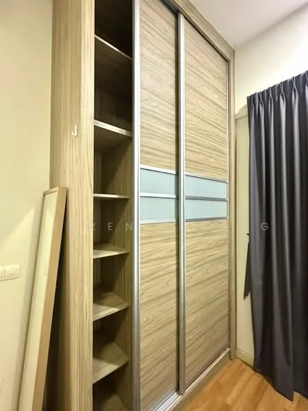 Room features: sliding wardrobe with wooden finish, glass panel inserts in wardrobe doors, built-in shelving unit, wooden flooring, grey curtain, neutral wall colour; style: modern.