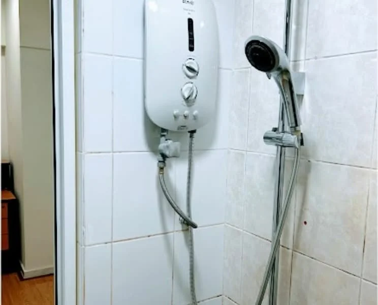 Bathroom features: white tiled walls, shower area, wall-mounted water heater, handheld showerhead, chrome shower valve, glass shower enclosure, wooden flooring; style: modern.