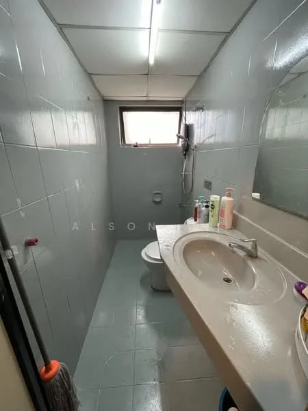 Bathroom features: grey tiled walls, grey tiled flooring, single-sink vanity with integrated basin, chrome faucet, mirror above sink, shower with handheld showerhead, toilet, window for natural light, light fixture on ceiling.