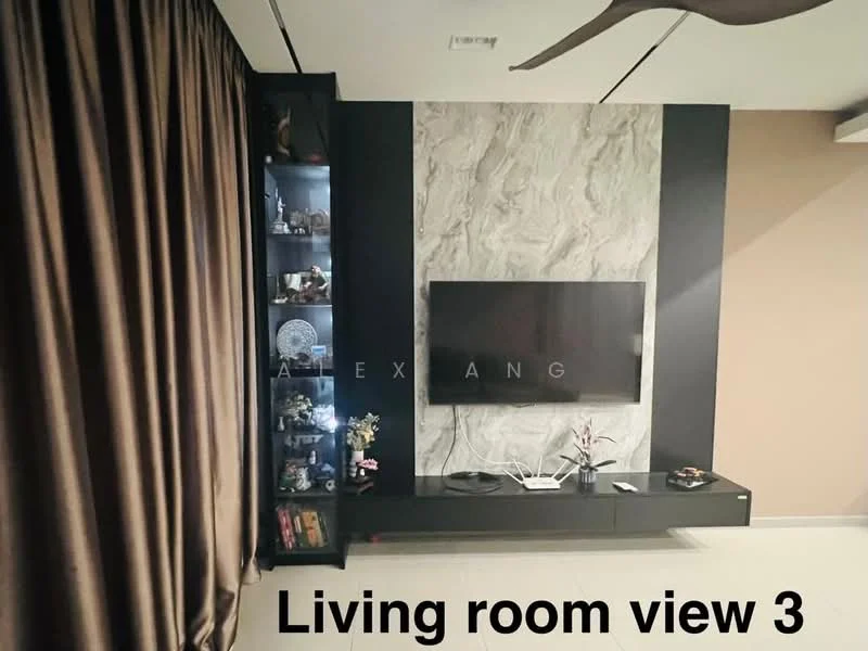 Living features: wall-mounted TV, black TV console, decorative shelving unit with glass doors, marble accent wall, brown curtains, light-colored flooring, decorative items on shelves, recessed lighting; style: modern.